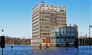 Carlisle Civic Centre amid floodwater, author Rose and Trev Clough, source Wikimedia