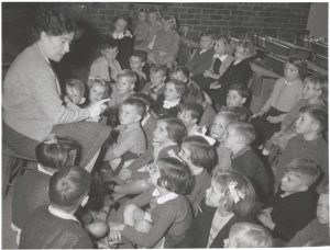 Miss Jean Lilburne with her class in the Grade One room at Drouin State School, Drouin, Victoria, 1916