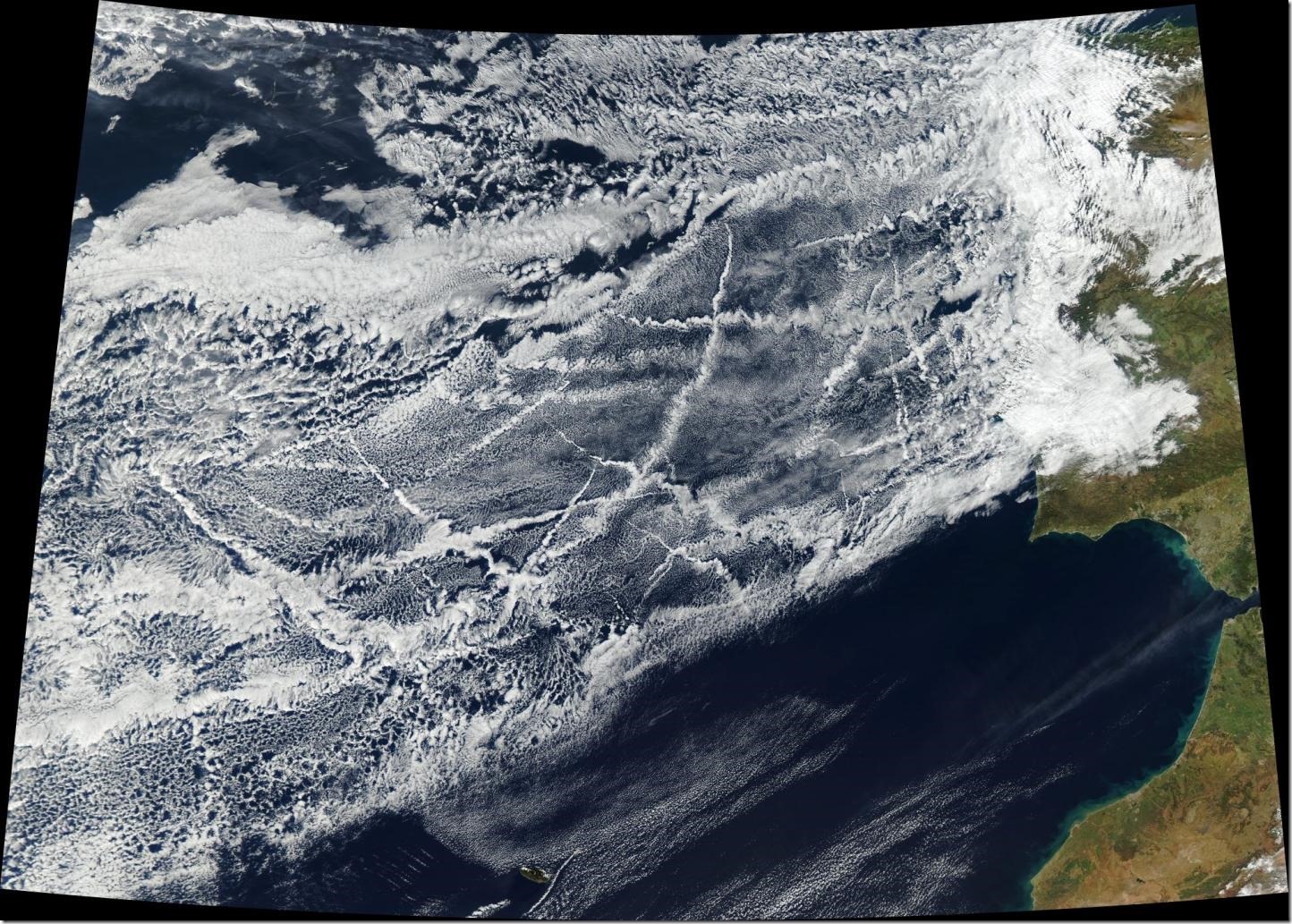 227622_web This satellite image was taken January 16, 2018, off the coast of Europe. Pollution from ships creates lines of clouds that can stretch hundreds of miles. The narrower ends of the clouds are youngest, while the broader, wavier ends are older. Credit NASA Earth Observatory