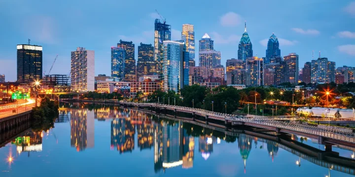 Philadelphia cityscape at sunrise with the Delaware river
