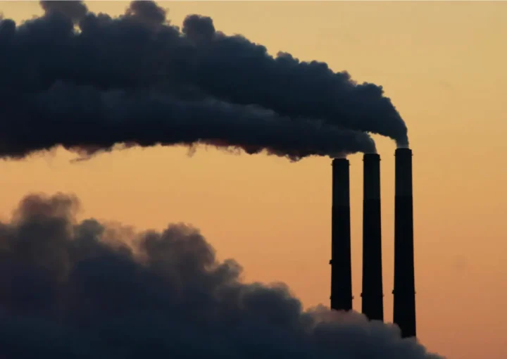 Silhouetted against the sky at dusk to make it appear as if it is black smoke, this power plant photo is actually showing steam.