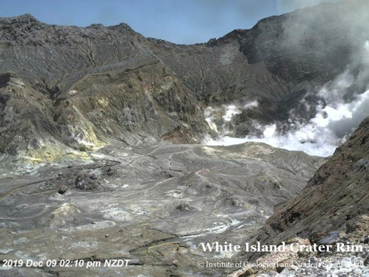 A webcam image showing hikers walking inside the crater of the Whakaari/White Island volcano, a minute before the 9 December, 2019 Whakaari/White Island eruption. Source: GNS Science (formerly the Institute of Geological and Nuclear Sciences)