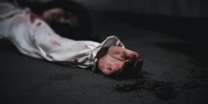 Closeup hand with blood of horror bloodthirsty ghost woman on floor, Homicide female hands jerky in blood with resentment torture and ask for help, murder and crime, Halloween horror day concept