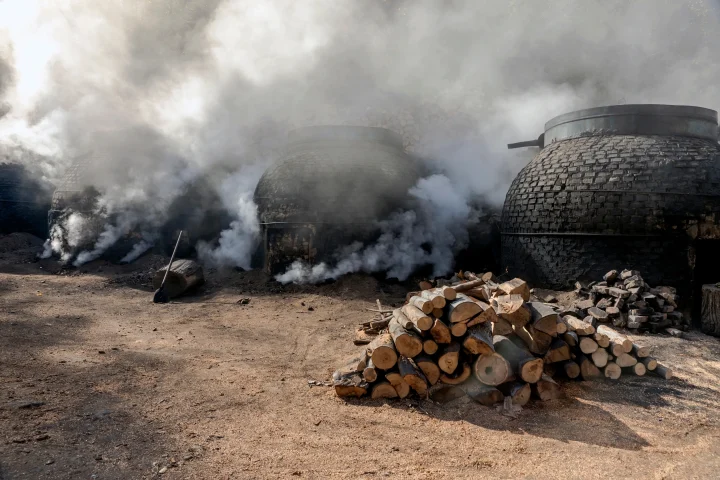 The production of charcoal in a traditional manner in the forest