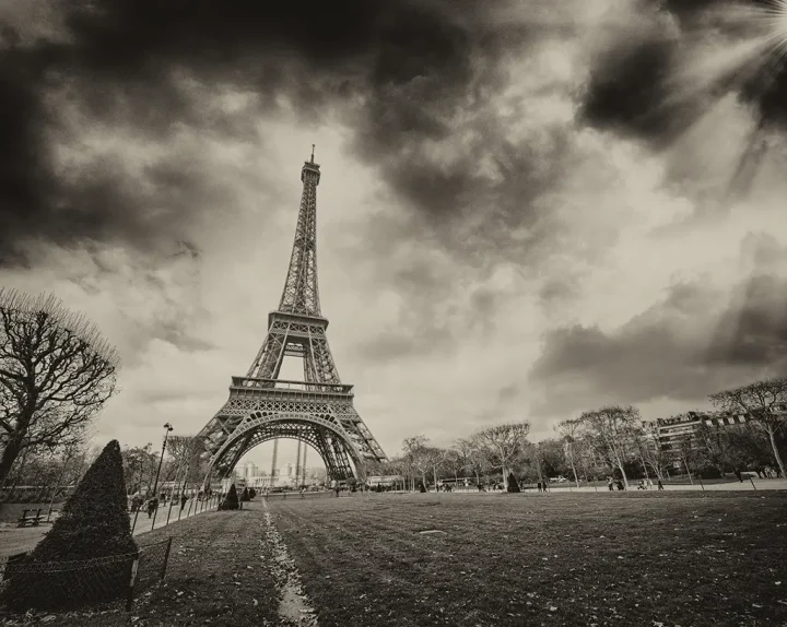  sunset over Eiffel Tower. Champs de Mars with beautiful sky colors.