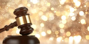 Legal Gavel on a Shiny Gold Bokeh Background,